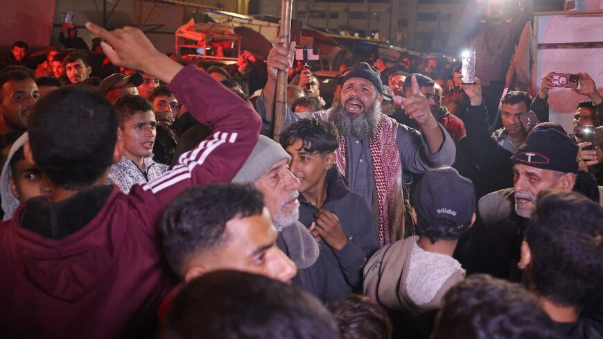 Gazans celebrate along a street in Khan Yunis after news spread of a ceasefire agreement between Hamas and Israel