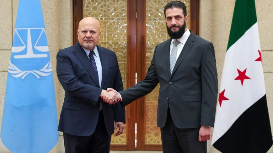 International Criminal Court chief prosecutor Karim Khan (L) meets Syria's new leader Ahmed al-Sharaa in Damascus.