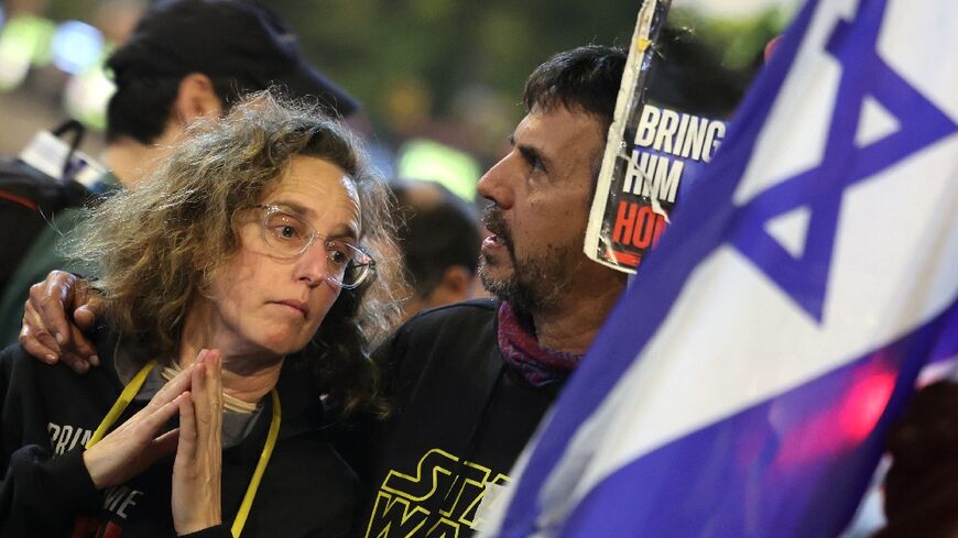 Demonstrators in Tel Aviv calling for the release of the hostages embraced as news of the agreement spread