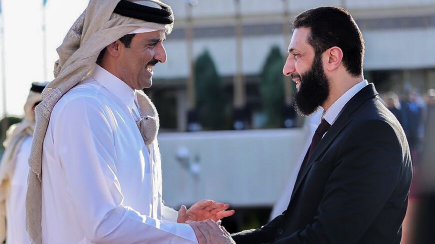 Syria's interim president Ahmed al-Sharaa bids farewell to Qatar's Emir Sheikh Tamim bin Hamad Al-Thani as he departs Damascus