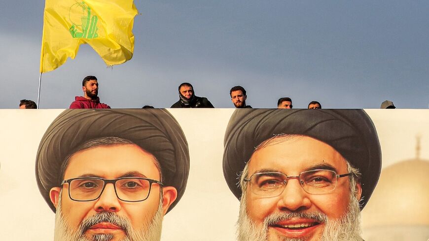 A giant portait of slain Hezbollah leader Hassan Nasrallah (R) and his heir apparent Hashem Safieddine watches over Beirut's airport highway ahead of their funeral on Sunday.