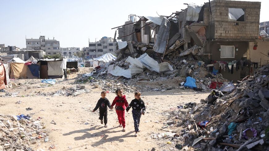 Palestinian children play among the rubble in Jabalia, northern Gaza 