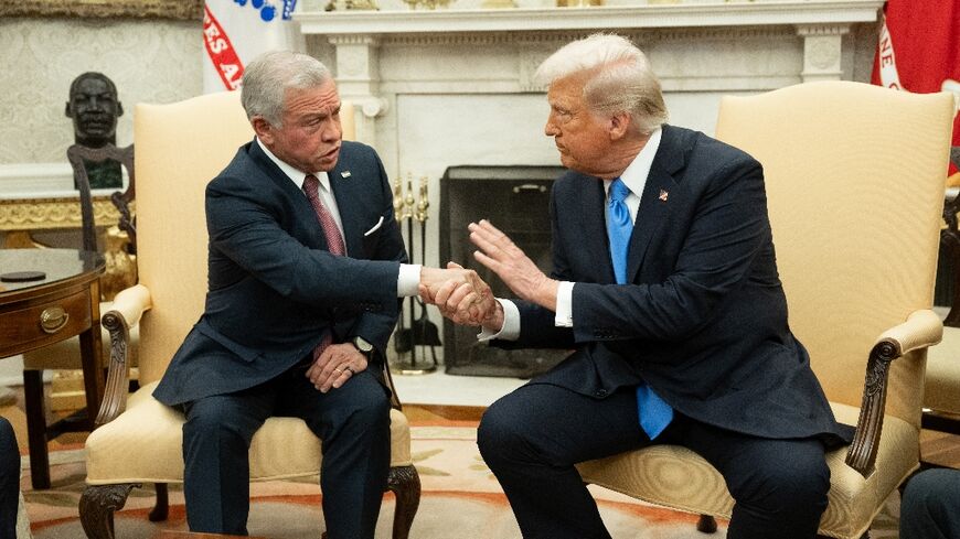 US President Donald Trump (R) shakes hands with King Abdullah II of Jordan during a meeting in the Oval Office of the White House in Washington, DC, on February 11, 2025.