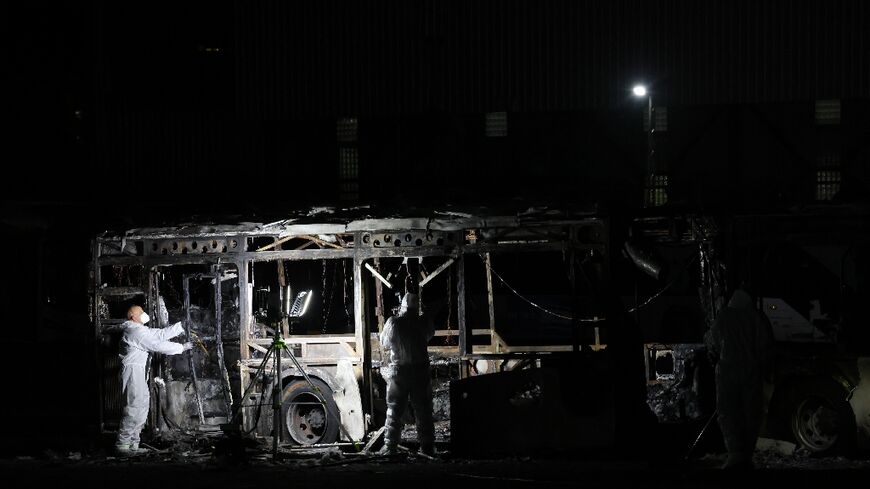 Security forces and bomb disposal units are deployed to the scene of a bus explosion in Bat Yam 