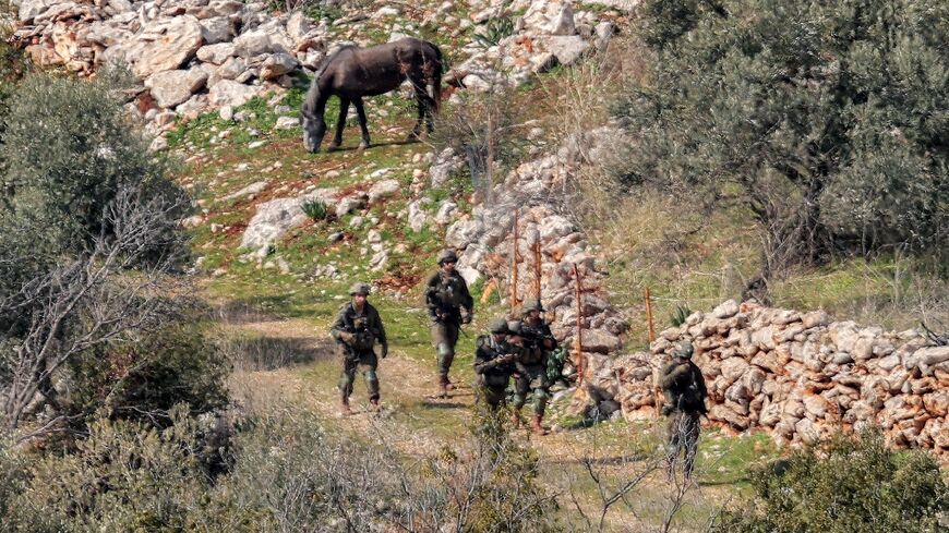 Israeli army forces patrol in the village of Kfarshuba in southern Lebanon on February 17, 2025