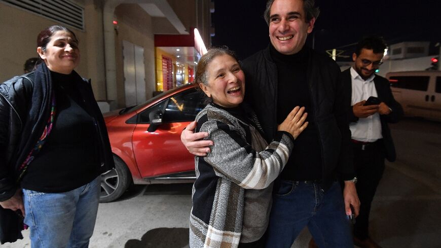 Prominent Tunisian human rights activist Sihem Bensedrine is welcomed on her release from jail in Manouba, near Tunis, after an appeals court ruling.