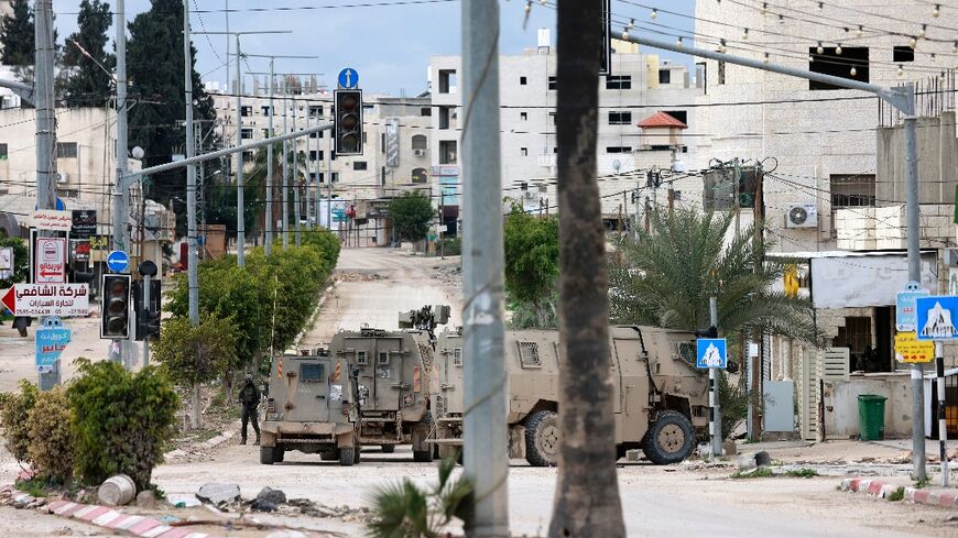 Israeli troops at the entrance to the occupied West Bank refugee camp of Tulkarem