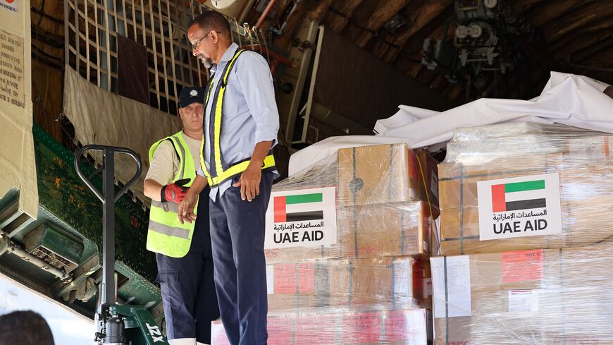 Workers unload aid from an aircraft upon it's arrival from the United Arab Emirates at the Port Sudan airport, on May 5, 2023. - Air strikes and gunfire rocked the Sudanese capital on May 5 as fighting showed no signs of abating, despite the threat of renewed US sanctions and warnings of a "protracted" conflict. (Photo by Giuseppe CACACE / AFP) (Photo by GIUSEPPE CACACE/AFP via Getty Images)