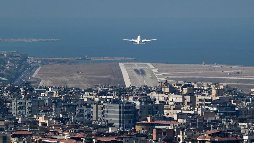 A commercial aircraft takes off from the runway of Beirut's international airport near the city's southern suburbs on Aug. 9, 2024.