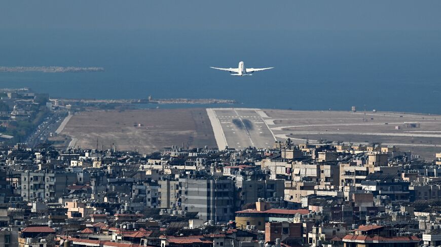 A commercial aircraft takes off from the runway of Beirut's international airport near the city's southern suburbs on Aug. 9, 2024. 