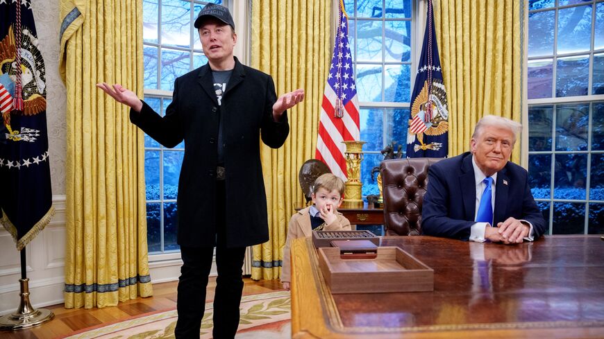 Tesla and SpaceX CEO Elon Musk, accompanied by his son, X Musk, speaks to the press as President Donald Trump looks on in the Oval Office at the White House, Washington, DC, Feb. 11, 2025.