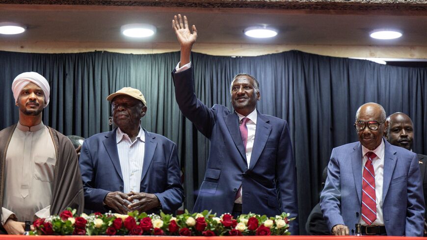 Abdul Rahim Hamdan Dagalo (C), Sudan's Rapid Support Forces deputy commander and brother to Mohamed Hamdan Dagalo (also known as Hemedti), flanked by representatives of other political parties affiliated to Sudan's Rapid Support Forces (SRF) react as they arrive at the venue ahead of their planned signing of the Government of Peace and Unity Charter, at the Kenyatta International Convention Centre (KICC) in Nairobi on February 18, 2025. (Photo by SIMON MAINA / AFP) (Photo by SIMON MAINA/AFP via Getty Images