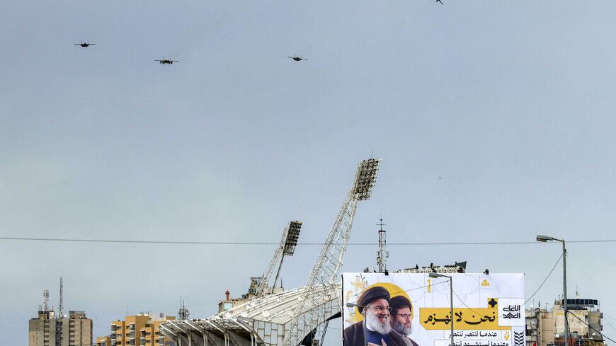 TOPSHOT - Israeli Air Force F-15 and F-35 fighter aircraft fly over Camille Chamoun Sports City Stadium on the outskirts of Beirut on February 23, 2025 during the funeral of slain Hezbollah leaders Hassan Nasrallah and Hashem Safieddine. Tens of thousands of mourners dressed in black vowed support for Hezbollah at the Beirut funeral of slain leader Hassan Nasrallah, after the group was dealt major blows in its last round of hostilities with Israel. The September killing of the charismatic leader, who led He