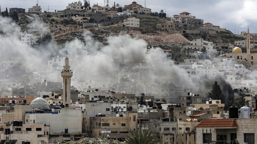 Smoke billows after an explosion over the Jenin camp for Palestinian refugees in the occupied West Bank during an Israeli raid on Feb. 24, 2025. 