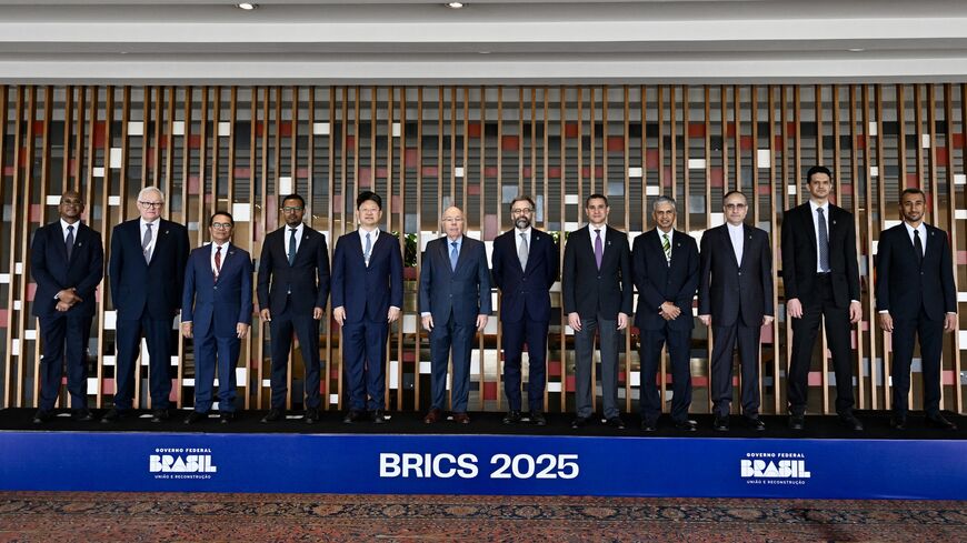 The United Arab Emirates' assistant sherpa to BRICS, Khamis Al-Shemeili (far right), poses for the family photo at the first BRICS sherpa meeting: (L-R) South Africa's Xolisa Mfundiso Mabhongo, Russia's Sergey Ryabkov, Indonesia's Tri Tharyat, Ethiopia's Mamo Esmelealem Mihretu, China's Tian Bai, Brazil's Foreign Minister Mauro Vieira, Brazil's Mauricio Lyrio, Egypt's Ragui Eletreby, India's Periasamy Kumaran, Iran's Majid Samadzadeh Saber, and Saudi Arabia's Ibrahim Alessa, in Brasilia, Feb. 25, 2025. 