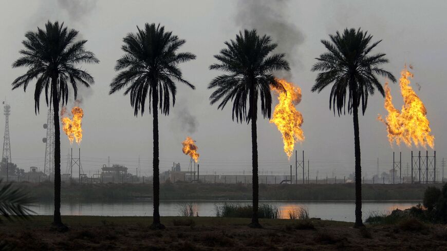 Flames rise from the burning of excess hydrocarbons at the Nahr Bin Omar natural gas field, north of the southern Iraqi port of Basra, Jan. 22, 2018.