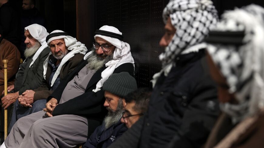 Palestinian families in Ramallah, the occupied West Bank, after Israel delayed the release of Palestinian prisoners