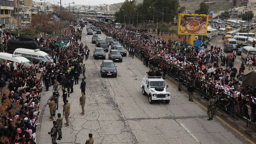 The crowds gathered despite cold and rain, many with placards expressing support for the position of King Abdullah II on Gaza