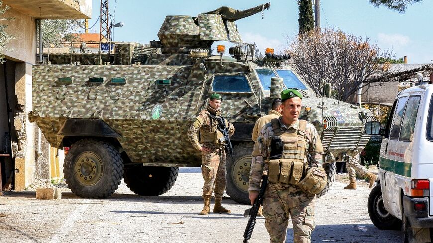 Lebanese army soldiers stand guard at the entrance of the southern Lebanese town of Hula