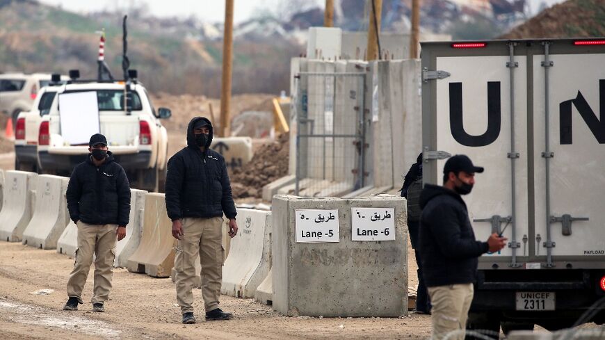 UN vehicles cross a checkpoint manned by Egyptian and US security on the Netzarim Corridor