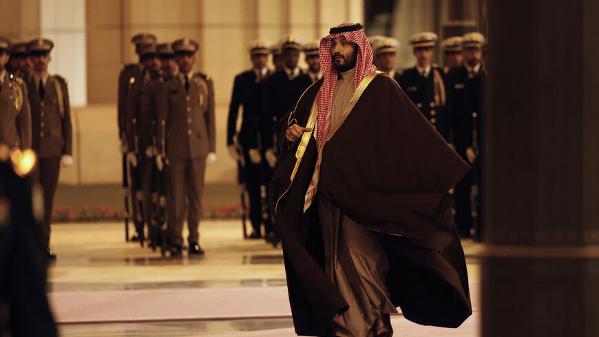 Saudi Arabia's Crown Prince Mohammed Bin Salman walks to welcome France's President (not pictured) ahead of their meeting in Riyadh on December 2, 2024. French President Emmanuel Macron touched down in Riyadh, the capital of the oil-rich Gulf kingdom, where he was due to hold talks with de facto ruler Crown Prince Mohammed bin Salman later on December 2, an AFP journalist said. (Photo by Ludovic MARIN / POOL / AFP) (Photo by LUDOVIC MARIN/POOL/AFP via Getty Images)