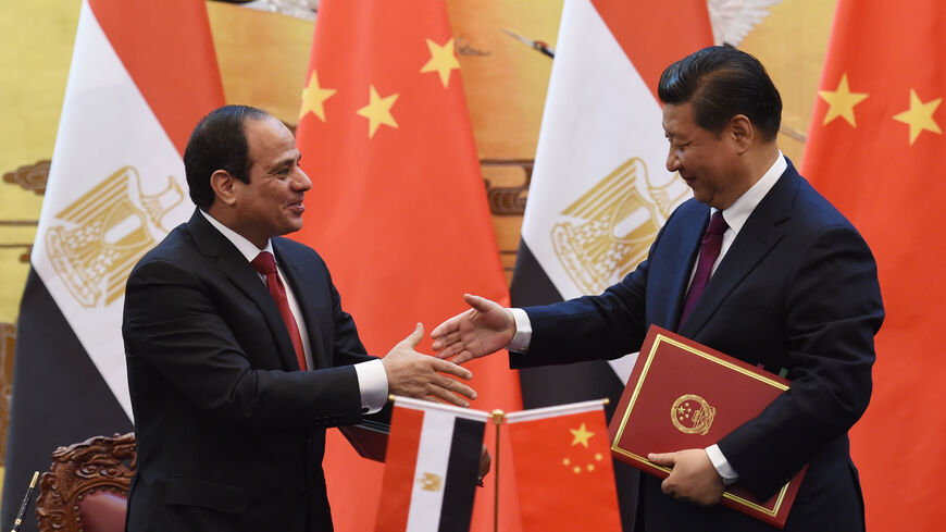 BEIJING, CHINA - DECEMBER 23: Egypt's President Abdel Fattah al-Sisi (L) greets Chinese President Xi Jinping (R) during a signing ceremony at the Great Hall of the People on December 23, 2014 in Beijing, China. President Abdel Fattah al-Sisi is undertaking his first visit to China in hopes to secure investment deals. (Photo by Greg Baker - Pool/Getty Images)