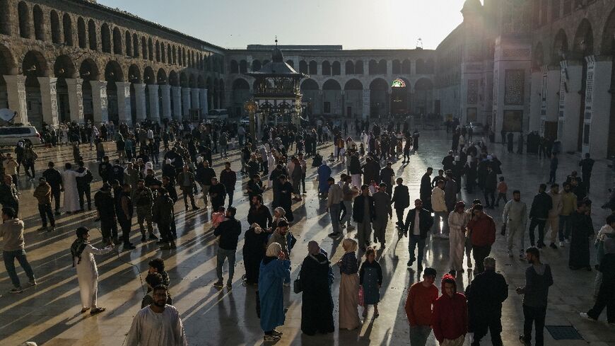 From the early morning hours, crowds of men, women and children flocked to pray at Damascus's historic Umayyad Mosque for Eid