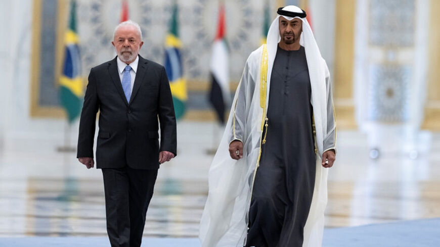 UAE President Sheikh Mohammed bin Zayed Al Nahyan walks with President Luiz Inacio Lula da Silva of Brazil, on an official visit to the United Arab Emirates, April 15, 2023.