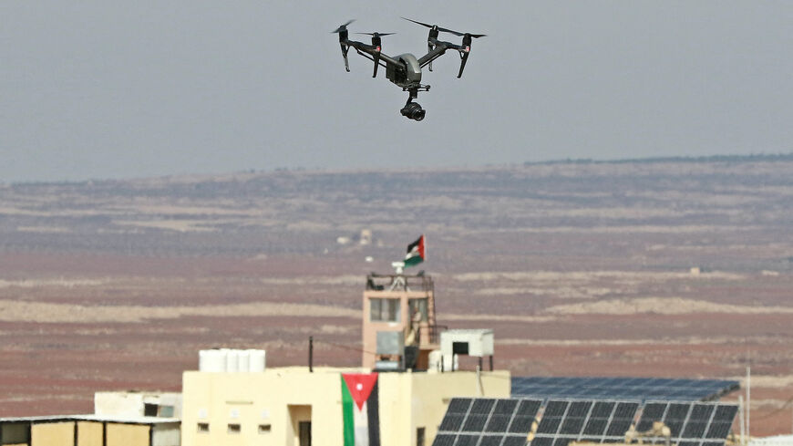 A picture taken during a tour organized by the Jordanian Army shows a drone flying over an observation post along the border with Syria, on Feb. 17, 2022.