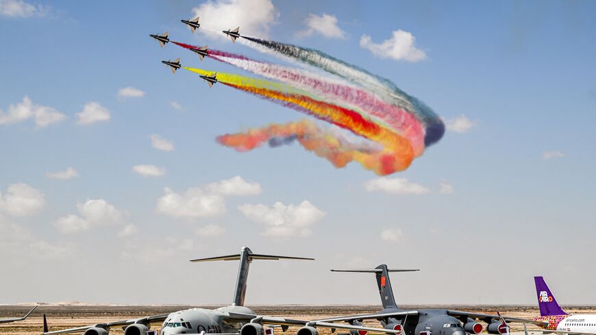 Chengdu J-10 Vigorous Dragon fighter aircraft of China's Ba Yi Aerobatics Team release smoke while performing during the first Egypt International Airshow at Alamein International Airport in northern Egypt on Sept. 4, 2024.