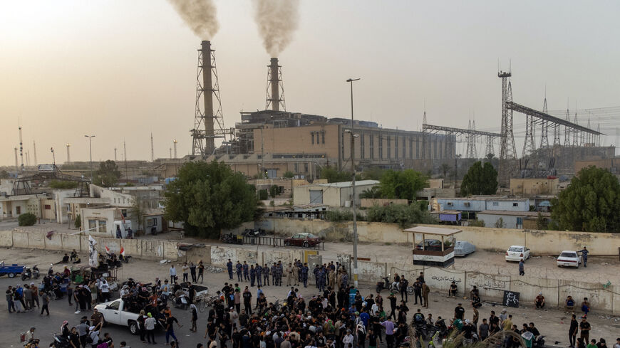 Demonstrators gather outside the thermal power station in Nasiriyah in Iraq's southern Dhi Qar province to demand the construction of a new station for their region, to allow the province to deal with the chronic power cuts and palliate electricity outage that weight on the daily life, on Sept. 4, 2024.