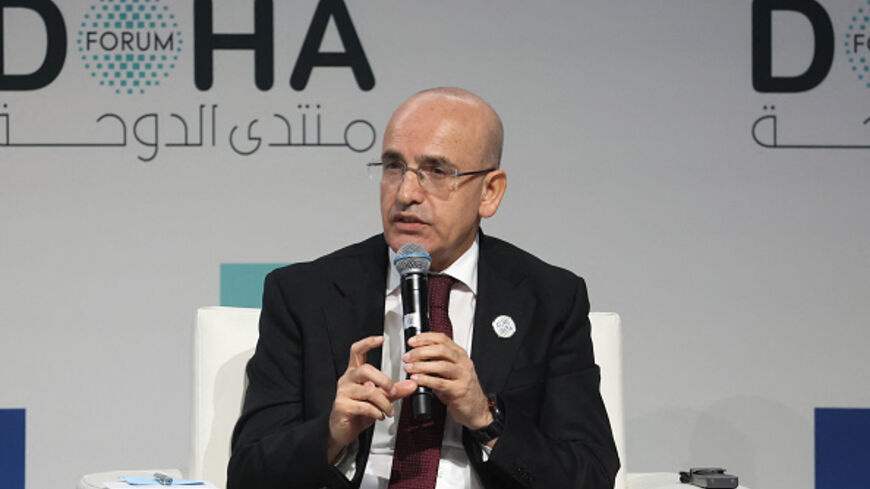 Turkey's Minister of Finance Mehmet Simsek takes part in a panel discussion during the Doha Forum in the Qatari capital on December 7, 2024. (Photo by KARIM JAAFAR / AFP) (Photo by KARIM JAAFAR/AFP via Getty Images)