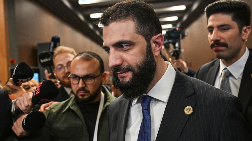 Syrian President Ahmed al-Sharaa (2nd R) leaves a bilateral room after his meeting with Qatar's minister of foreign affairs during the Antalya Diplomacy Forum, Antalya, April 11, 2025.