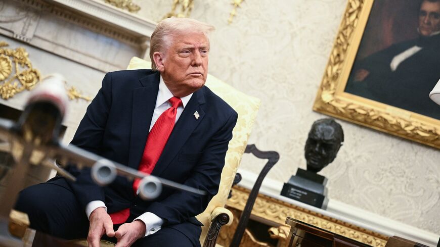 US President Donald Trump looks on during a meeting with El Salvador's President Nayib Bukele in the Oval Office of the White House in Washington, on April 14, 2025.