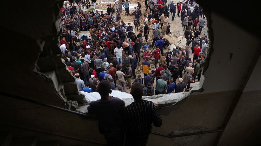 Palestinians bury relatives killed in overnight Israeli strikes in northern Gaza 
