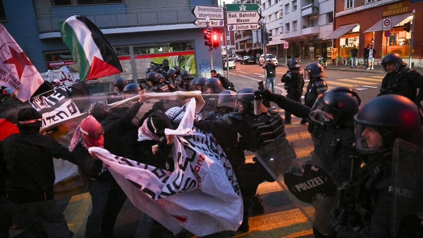 Anti-riot police officers used pepper spray to restrain activists during a demonstration against Israel's participation in Eurovision