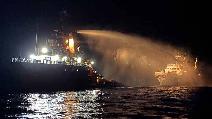 This handout picture released by the Malta Government press office shows a Malta Vessel Traffic Services providing assistance at sea to the Conscience 