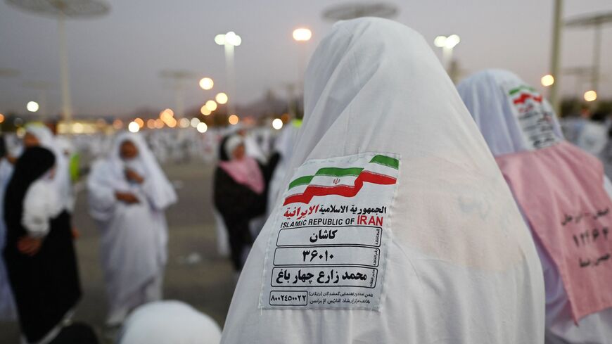 Iranian Muslim pilgrims head to Saudi Arabia's Mount Arafat, also known as Jabal al-Rahma or Mount of Mercy, during the climax of the Hajj pilgrimage, on June 27, 2023.