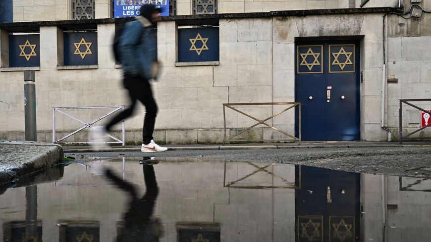 A man walks by the synagogue of Rouen, in northwestern France, on Jan. 7, 2025, following the discovery of an antisemitic graffiti.