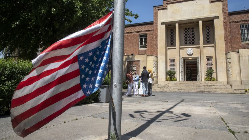 The US flag is seen hung upside down at the former US Embassy in downtown Tehran on April 19, 2025, in Tehran, Iran.