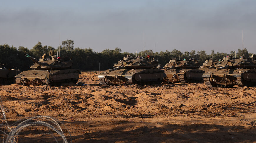Israeli army tanks are deployed at a position near Israel's border with the Gaza Strip, on May 5, 2025. Israel was issuing orders to call up tens of thousands of reservists ahead of an expanded offensive in Gaza, Israeli media reported on May 3, as Prime Minister Benjamin Netanyahu attacked truce mediator Qatar. (Photo by Menahem KAHANA / AFP) (Photo by MENAHEM KAHANA/AFP via Getty Images)