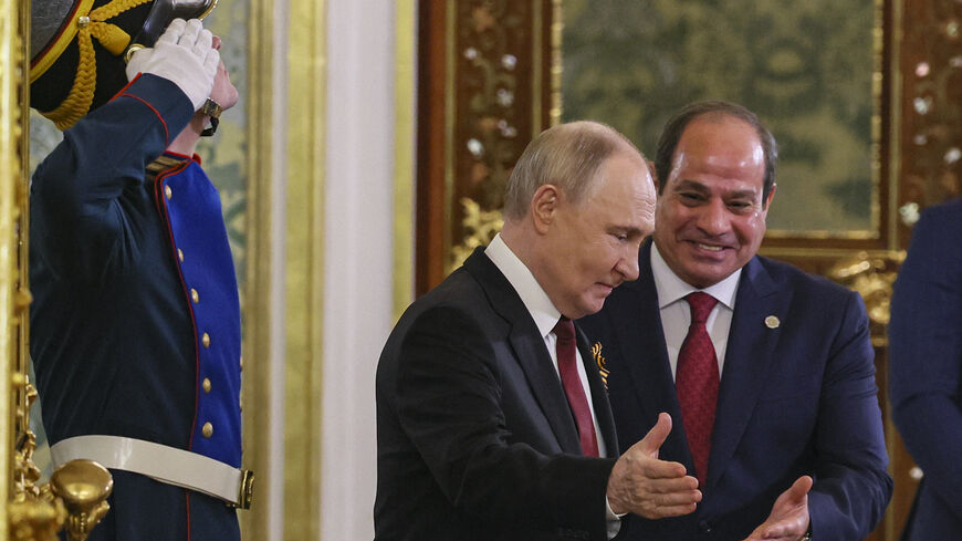 Russian President Vladimir Putin meets with Egyptian President Abdel Fattah El-Sisi at the Kremlin in Moscow on May 9, 2025. (Photo by YURI KOCHETKOV / POOL / AFP) (Photo by YURI KOCHETKOV/POOL/AFP via Getty Images)