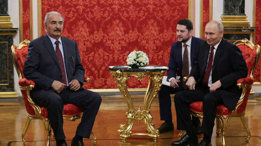 In this pool photograph distributed by Russian state agency Sputnik, Russia's President Vladimir Putin (R) and Libya's eastern military strongman Khalifa Haftar (L) attend their meeting in Moscow on May 10, 2025, during celebrations of the 80th anniversary of the Soviet Union's victory over Nazi Germany in World War Two. (Photo by Gavriil GRIGOROV / POOL / AFP) (Photo by GAVRIIL GRIGOROV/POOL/AFP via Getty Images)