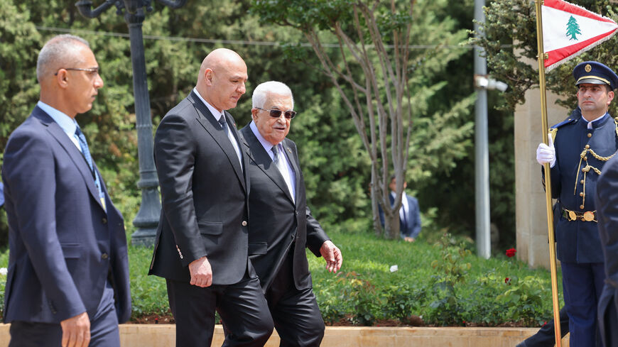 Lebanese President Joseph Aoun (2nd L) walks alongside Palestinian Authority President Mahmud Abbas as they review an honour guard at the Presidential Palace in Baabda, on May 21, 2025.