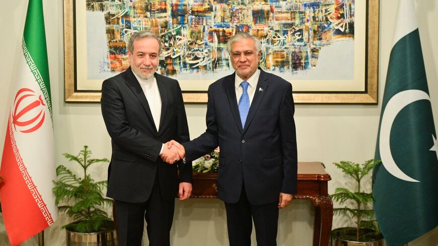 Iranian Foreign Minister Abbas Araghchi (L) meets with his Pakistani counterpart Mohammad Ishaq Dar in Islamabad on May 5, 2025.