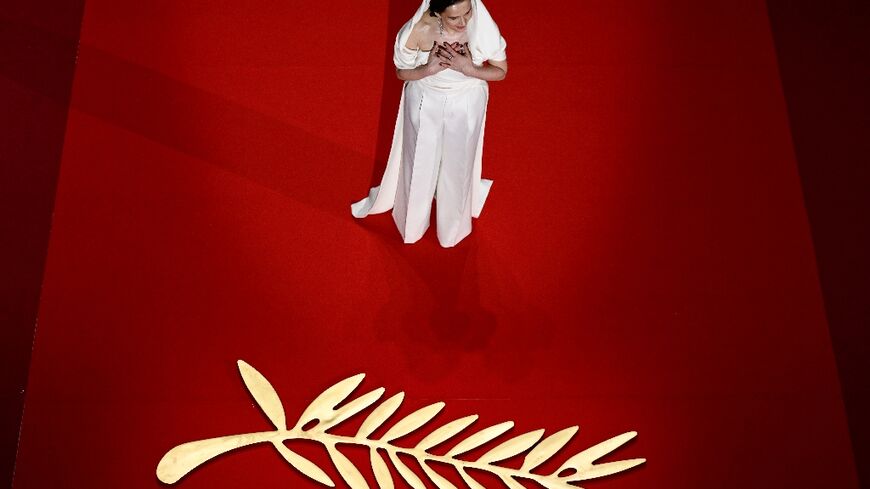 French actress Binoche arrives on stage during the opening ceremony 