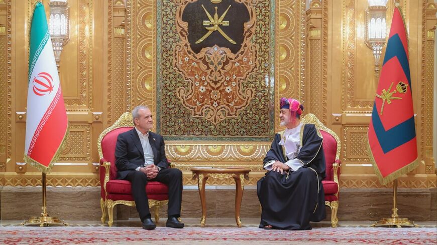 Oman's Sultan Haitham bin Tariq (R) officially welcomes Iranian President Mahmoud Pezeshkian at Muscat's Al Alam Palace, on May 27, 2025.