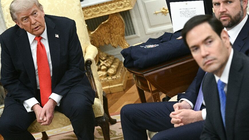 US President Donald Trump, Vice President JD Vance, and US Secretary of State Marco Rubio look on during a meeting with German Chancellor Friedrich Merz in the Oval Office
