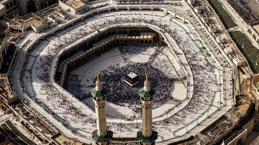 Muslim worshippers gather around the Kaaba, Islam's holiest shrine, at the Grand Mosque complex in the holy city of Mecca 