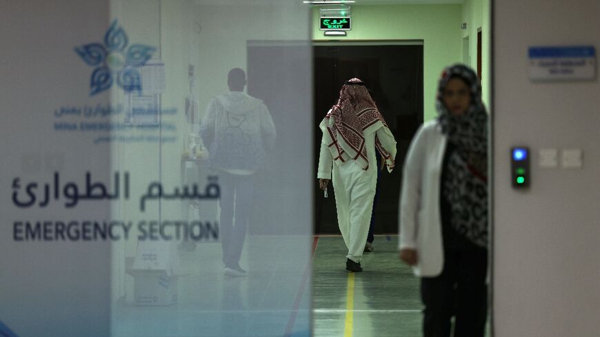 Medics and people walk at a heat stroke treatment unit at the Mina Emergency Hospital in the holy city of Mecca 